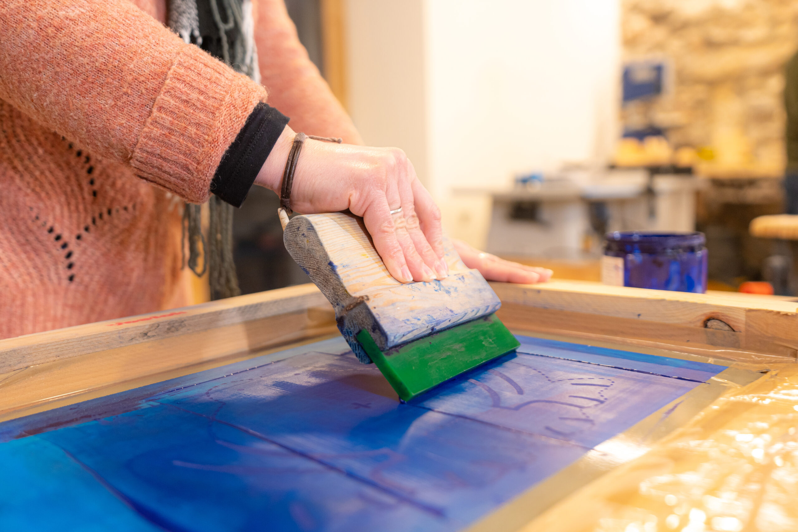 Woman preparing to make another custom branded tshirts