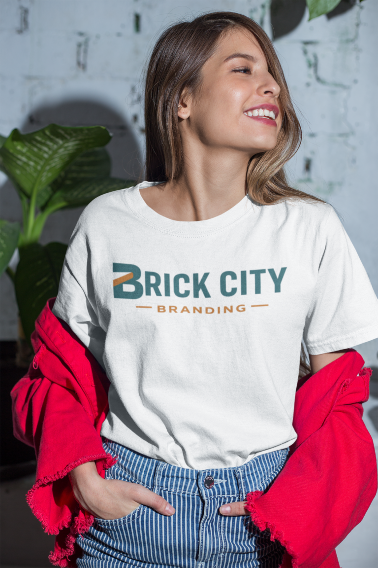 Woman wearing a white branded t-shirt with a Brick City Branding logo in Newark, NJ.