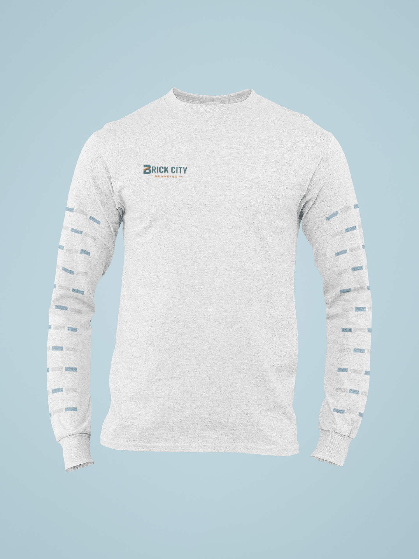 A light grey long-sleeve shirt with the Brick City Branding logo on the right chest and a repetitive teal and orange rectangular pattern printed down both sleeves.