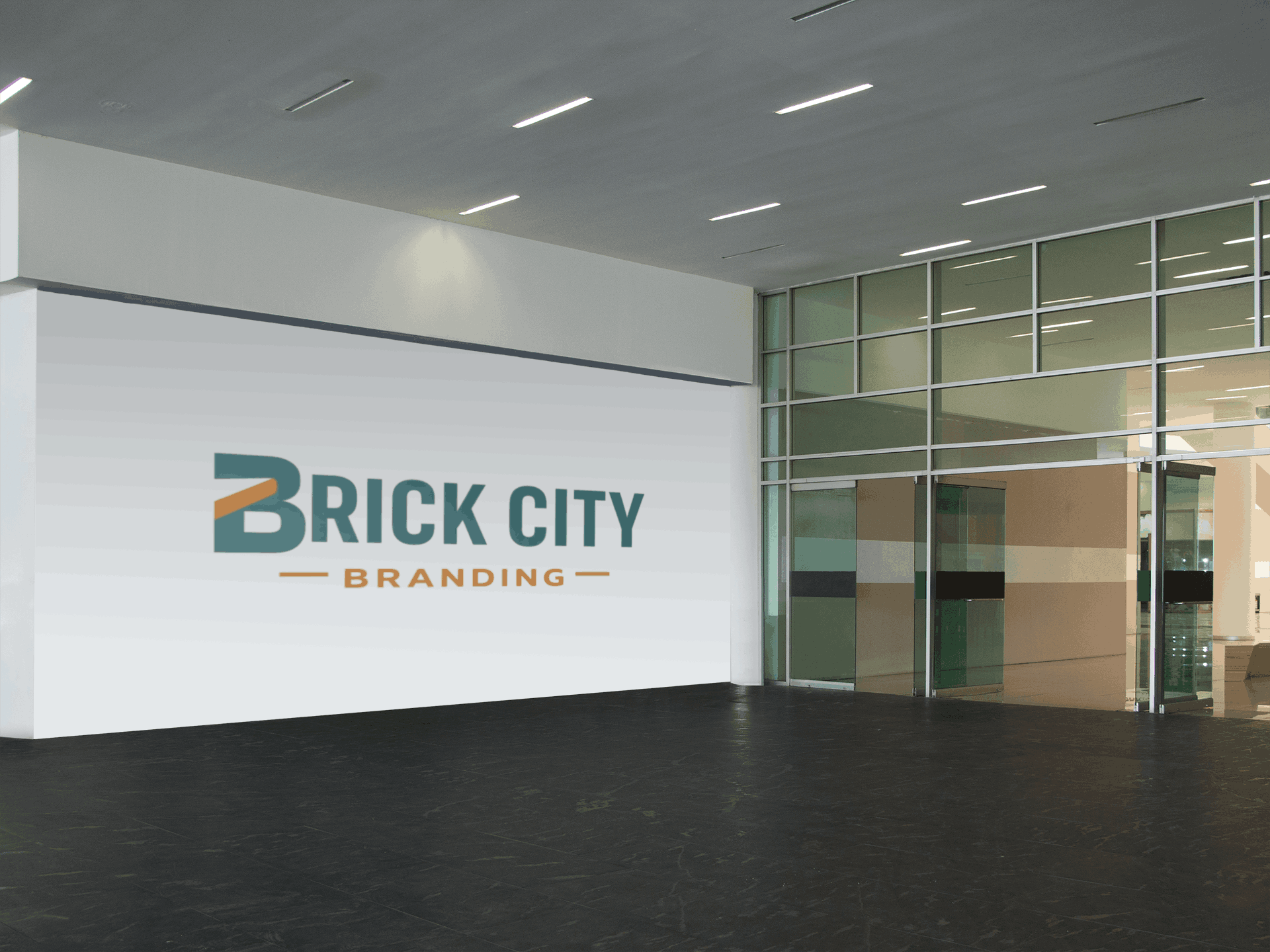 Large-scale Brick City Branding exterior vinyl signs applied as a wall graphic in a modern glass-fronted building lobby with polished dark floors.