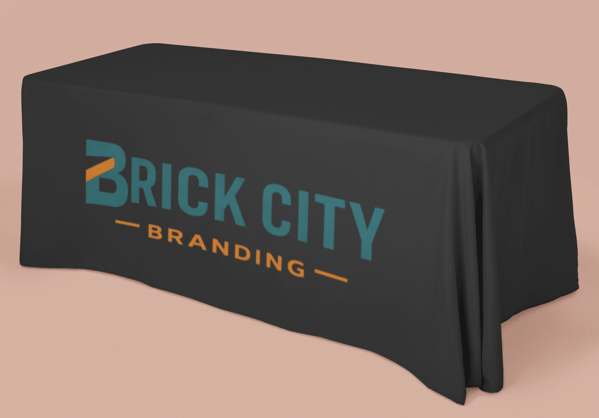 A 6-foot rectangular black custom branded table cloth featuring the Brick City Branding logo in teal and orange on the front drape.