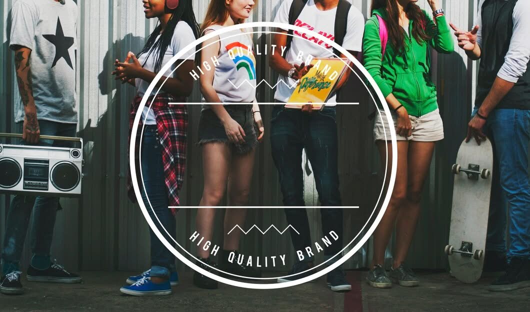 A group of diverse young adults in casual streetwear standing against a metal wall, featuring a boombox, skateboard, and a circular "High Quality Brand" graphic overlay.