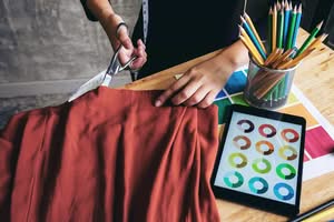 Our Blog for Growth & Creative Strategy 31 fashion designer cutting fabric color theory tablet